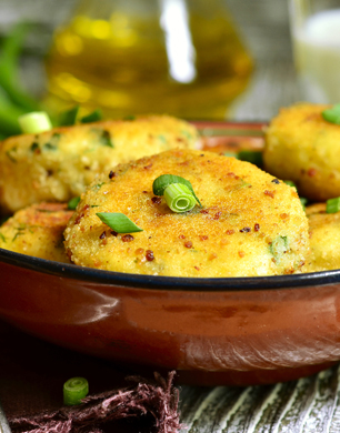 Homemade potato patties with herbs and green onion.