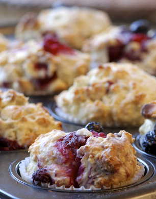 Freshly baked muffins with mixed berries and white chocolate